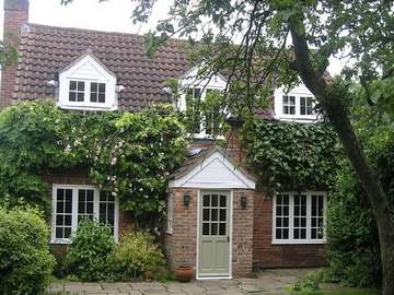 Delemere Forest : Installation of G. Barnsdale's Red grandis timber windows and door. Storm proof profile . Astragal bar design to match original windows. Precoated white - Sikkins Micro-porous paint range 